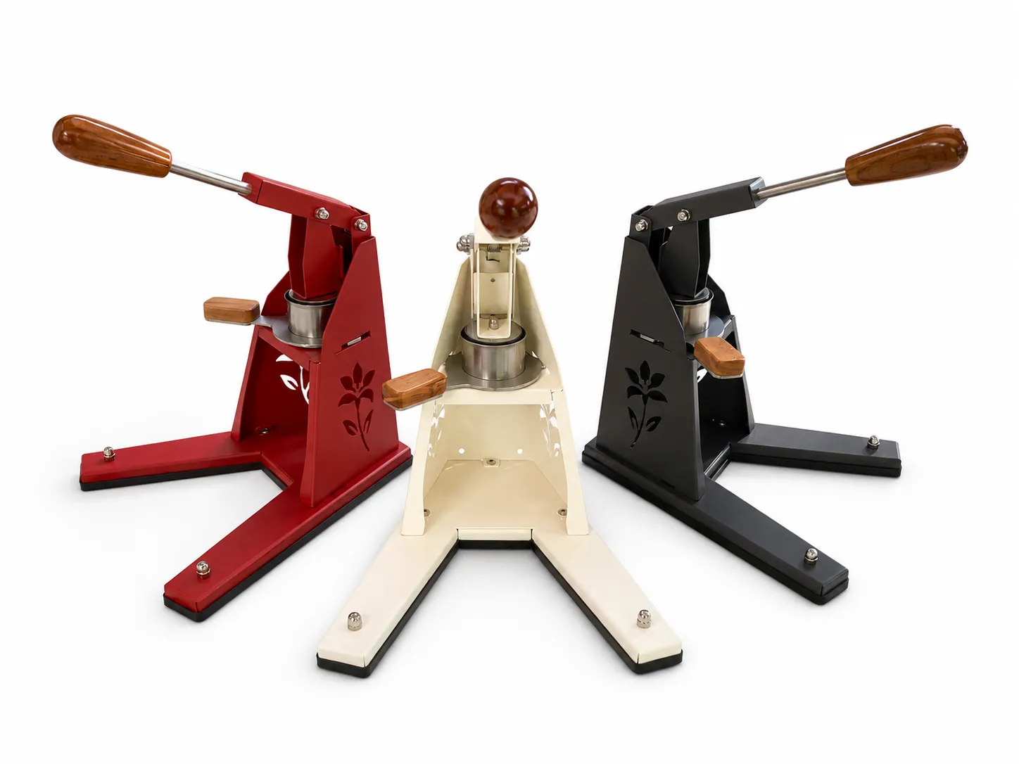 Three Silver Lily machines side by side in red, cream, and matte black powder-coat finishes with hardwood handles